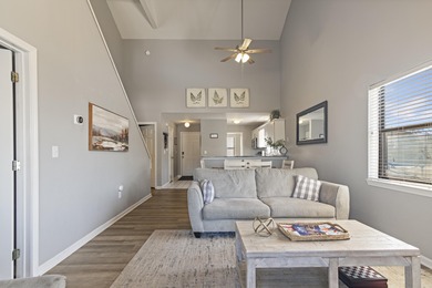 Discover refined living at its best in this pristine corner-unit on Pointe Royale Village Country Club in Missouri - for sale on GolfHomes.com, golf home, golf lot