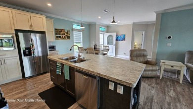 Welcome to 3915 Scramble Drive, a stunning 2018 Palm Harbor home on The Riverside Golf Club in Florida - for sale on GolfHomes.com, golf home, golf lot