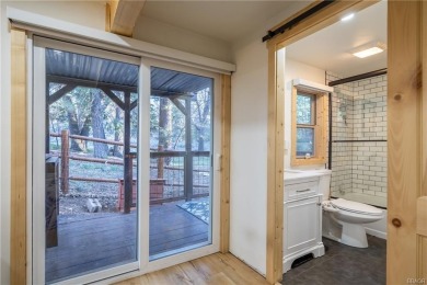 Embrace nature's beauty in this authentic log cabin, boasting on Big Bear Mountain Ski and Golf Resort in California - for sale on GolfHomes.com, golf home, golf lot