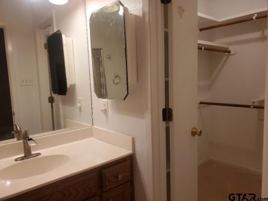 Beautiful chalet style home with Personality plus nestled on two on Holly Lake Ranch Golf Club in Texas - for sale on GolfHomes.com, golf home, golf lot