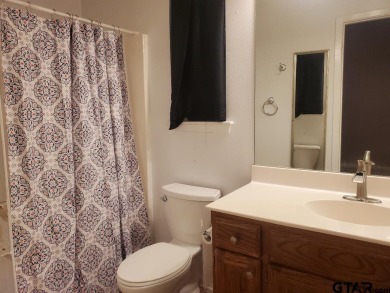 Beautiful chalet style home with Personality plus nestled on two on Holly Lake Ranch Golf Club in Texas - for sale on GolfHomes.com, golf home, golf lot