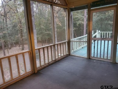 Beautiful chalet style home with Personality plus nestled on two on Holly Lake Ranch Golf Club in Texas - for sale on GolfHomes.com, golf home, golf lot