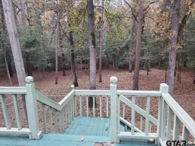 Beautiful chalet style home with Personality plus nestled on two on Holly Lake Ranch Golf Club in Texas - for sale on GolfHomes.com, golf home, golf lot