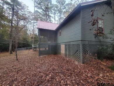 Beautiful chalet style home with Personality plus nestled on two on Holly Lake Ranch Golf Club in Texas - for sale on GolfHomes.com, golf home, golf lot