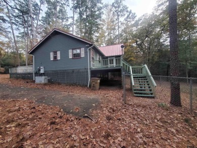 Beautiful chalet style home with Personality plus nestled on two on Holly Lake Ranch Golf Club in Texas - for sale on GolfHomes.com, golf home, golf lot