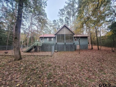 Beautiful chalet style home with Personality plus nestled on two on Holly Lake Ranch Golf Club in Texas - for sale on GolfHomes.com, golf home, golf lot
