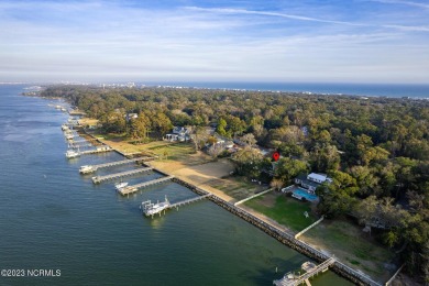 This stunning soundfront home in Pine Knoll Shores has been on The Country Club of the Crystal Coast in North Carolina - for sale on GolfHomes.com, golf home, golf lot