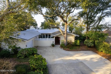This stunning soundfront home in Pine Knoll Shores has been on The Country Club of the Crystal Coast in North Carolina - for sale on GolfHomes.com, golf home, golf lot