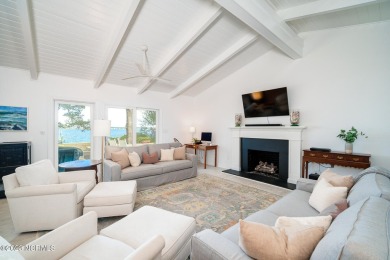 This stunning soundfront home in Pine Knoll Shores has been on The Country Club of the Crystal Coast in North Carolina - for sale on GolfHomes.com, golf home, golf lot