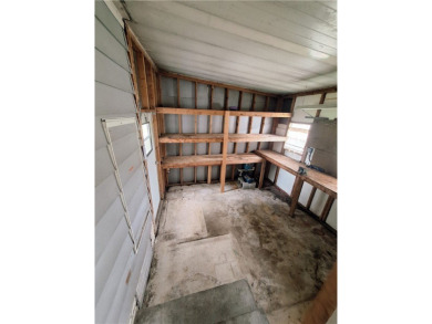Perfect for seasonal home or rental opportunity! This spacious on Barefoot Bay Golf Course in Florida - for sale on GolfHomes.com, golf home, golf lot