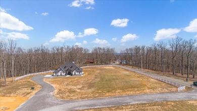 Nestled within the verdant embrace of Tennessee's picturesque on Sweetens Cove Golf Club in Tennessee - for sale on GolfHomes.com, golf home, golf lot