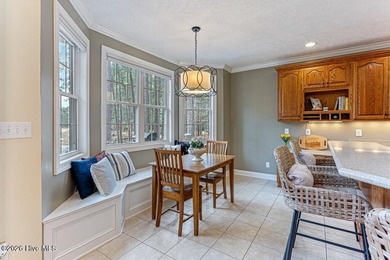 Stunning waterfront brick home located in the gated community of on Woodlake Country Club in North Carolina - for sale on GolfHomes.com, golf home, golf lot