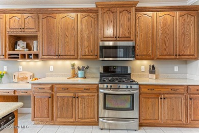 Stunning waterfront brick home located in the gated community of on Woodlake Country Club in North Carolina - for sale on GolfHomes.com, golf home, golf lot