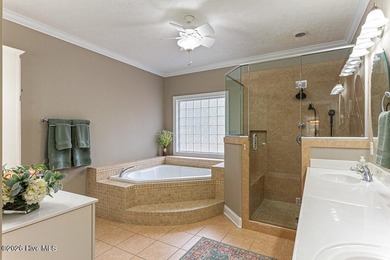 Stunning waterfront brick home located in the gated community of on Woodlake Country Club in North Carolina - for sale on GolfHomes.com, golf home, golf lot