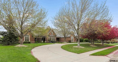 This gorgeous, custom-built home sits on a nearly 1-acre lot on Indian Creek Golf Club in Nebraska - for sale on GolfHomes.com, golf home, golf lot