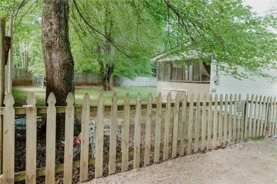 Check out this very welcoming home with a nice leveled front and on Nob North Golf Course in Georgia - for sale on GolfHomes.com, golf home, golf lot