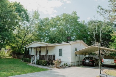 Check out this very welcoming home with a nice leveled front and on Nob North Golf Course in Georgia - for sale on GolfHomes.com, golf home, golf lot