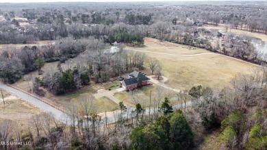 Welcome to this elegant 6-bedroom, 4.5-bathroom home with a on Colonial Country Club Deerfield in Mississippi - for sale on GolfHomes.com, golf home, golf lot