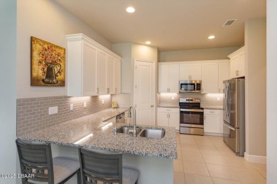This end-unit townhome located in the highly sought after on Plantation Bay Golf and Country Club in Florida - for sale on GolfHomes.com, golf home, golf lot