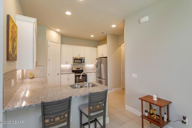 This end-unit townhome located in the highly sought after on Plantation Bay Golf and Country Club in Florida - for sale on GolfHomes.com, golf home, golf lot