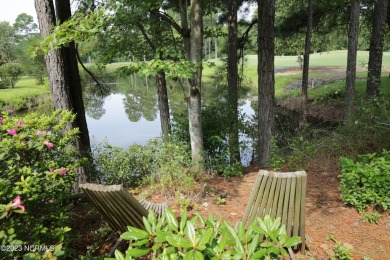 An unusual architectural creation with emphasis on simple on Magnolia Greens Golf Plantation in North Carolina - for sale on GolfHomes.com, golf home, golf lot