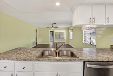 Front porch Water view. Wide Open and bright. Clean. Well on Beacon Woods Golf Club in Florida - for sale on GolfHomes.com, golf home, golf lot