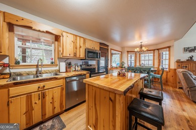 This refined mountain retreat delivers a rare combination of on Old Union Golf Course in Georgia - for sale on GolfHomes.com, golf home, golf lot