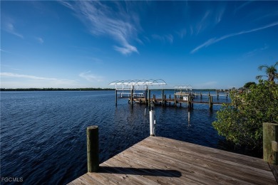 This waterfront home places the Peace River right in your on Deep Creek Golf Club in Florida - for sale on GolfHomes.com, golf home, golf lot
