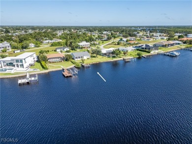 This waterfront home places the Peace River right in your on Deep Creek Golf Club in Florida - for sale on GolfHomes.com, golf home, golf lot
