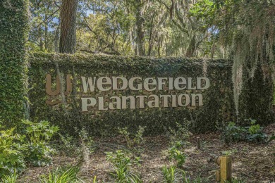 Check out this beautifully landscaped brick and wood exterior on Wedgefield Plantation Golf Club in South Carolina - for sale on GolfHomes.com, golf home, golf lot