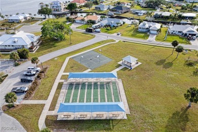 This waterfront home places the Peace River right in your on Deep Creek Golf Club in Florida - for sale on GolfHomes.com, golf home, golf lot
