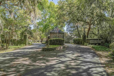 Check out this beautifully landscaped brick and wood exterior on Wedgefield Plantation Golf Club in South Carolina - for sale on GolfHomes.com, golf home, golf lot