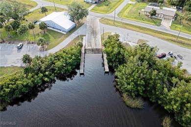 This waterfront home places the Peace River right in your on Deep Creek Golf Club in Florida - for sale on GolfHomes.com, golf home, golf lot