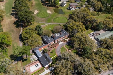 Check out this beautifully landscaped brick and wood exterior on Wedgefield Plantation Golf Club in South Carolina - for sale on GolfHomes.com, golf home, golf lot