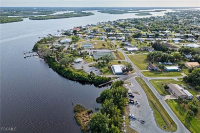 This waterfront home places the Peace River right in your on Deep Creek Golf Club in Florida - for sale on GolfHomes.com, golf home, golf lot