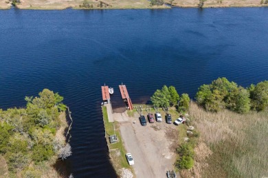 Check out this beautifully landscaped brick and wood exterior on Wedgefield Plantation Golf Club in South Carolina - for sale on GolfHomes.com, golf home, golf lot