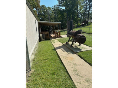 Location! Location! This Waterview 3B/2B MH is walk in ready & on Cypress Bend Golf Course in Texas - for sale on GolfHomes.com, golf home, golf lot