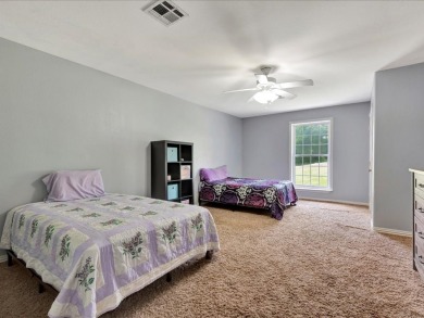 This sizable home has 5-bedrooms and 3 updated bathrooms. There on Woodland Hills Golf Club in Texas - for sale on GolfHomes.com, golf home, golf lot