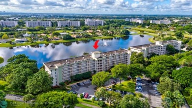 Enjoy serene water views of the lake and fountain as soon as you on Palm-Aire Country Club and Resort - Palms in Florida - for sale on GolfHomes.com, golf home, golf lot