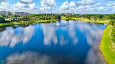 Enjoy serene water views of the lake and fountain as soon as you on Palm-Aire Country Club and Resort - Palms in Florida - for sale on GolfHomes.com, golf home, golf lot