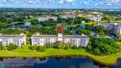 Enjoy serene water views of the lake and fountain as soon as you on Palm-Aire Country Club and Resort - Palms in Florida - for sale on GolfHomes.com, golf home, golf lot