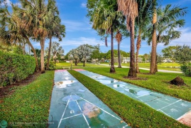 Enjoy serene water views of the lake and fountain as soon as you on Palm-Aire Country Club and Resort - Palms in Florida - for sale on GolfHomes.com, golf home, golf lot