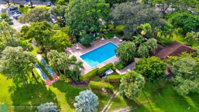 Enjoy serene water views of the lake and fountain as soon as you on Palm-Aire Country Club and Resort - Palms in Florida - for sale on GolfHomes.com, golf home, golf lot