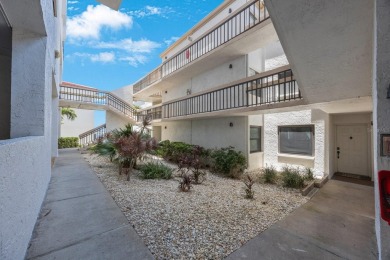 Experience Waterfront Living in this Charming 2-Bed, 2-Bath on Isla Del Sol Yacht and Country Club in Florida - for sale on GolfHomes.com, golf home, golf lot