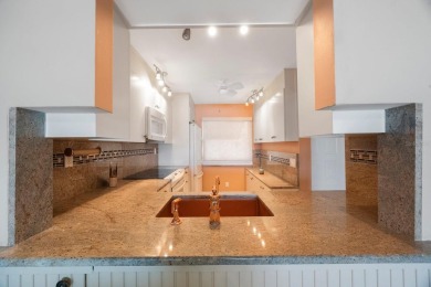 Experience Waterfront Living in this Charming 2-Bed, 2-Bath on Isla Del Sol Yacht and Country Club in Florida - for sale on GolfHomes.com, golf home, golf lot