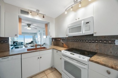 Experience Waterfront Living in this Charming 2-Bed, 2-Bath on Isla Del Sol Yacht and Country Club in Florida - for sale on GolfHomes.com, golf home, golf lot