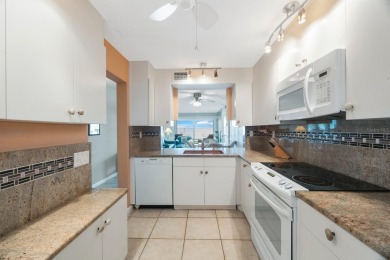 Experience Waterfront Living in this Charming 2-Bed, 2-Bath on Isla Del Sol Yacht and Country Club in Florida - for sale on GolfHomes.com, golf home, golf lot