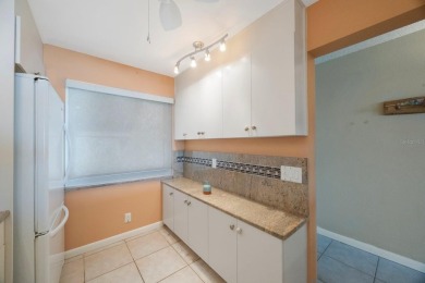 Experience Waterfront Living in this Charming 2-Bed, 2-Bath on Isla Del Sol Yacht and Country Club in Florida - for sale on GolfHomes.com, golf home, golf lot