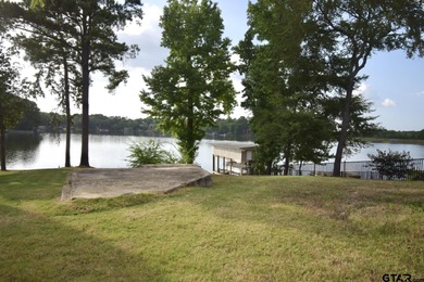 Lakeside Serenity Awaits at 616 Hideaway Lane East!  Tucked on Hide-A-Way Lake Golf Course in Texas - for sale on GolfHomes.com, golf home, golf lot