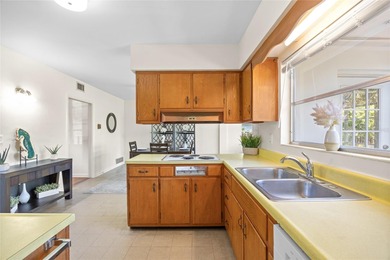 Step back in time and fall in love with this vintage Dunedin on The Dunedin Country Club in Florida - for sale on GolfHomes.com, golf home, golf lot